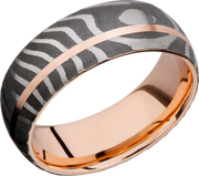 Handmade 8mm Tiger Damascus steel band featuring a sleeve and off-center inlay of 14K rose gold
