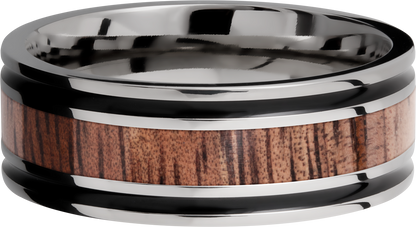 Titanium 8mm flat band with antiquing on both sides of an Koa hardwood inlay