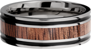 Titanium 8mm flat band with antiquing on both sides of an Koa hardwood inlay