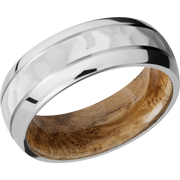 Cobalt chrome 8mm domed band with 2, .5mm grooves and a sleeve of Whiskey Barrel hardwood